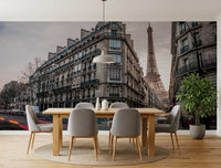 Dining room illuminated by streetlights from the Parisian Evening wall mural.