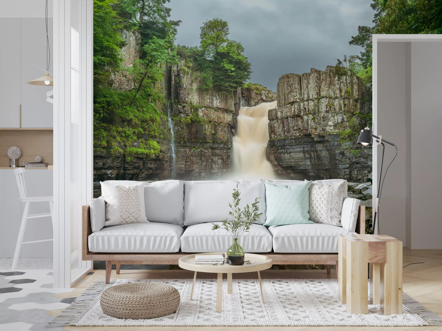Greenery from a Falls wall mural surrounds a lounge space.