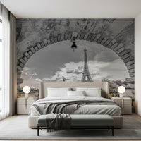 Paris in grayscale via the Parisian Vista wall mural lifts a Bedroom