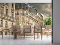 Cloud-darkened skies climb above a Dining area in this Parisian wall mural.