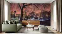 Pink twilight skies open across the living room in this Central Park bridge wall mural.