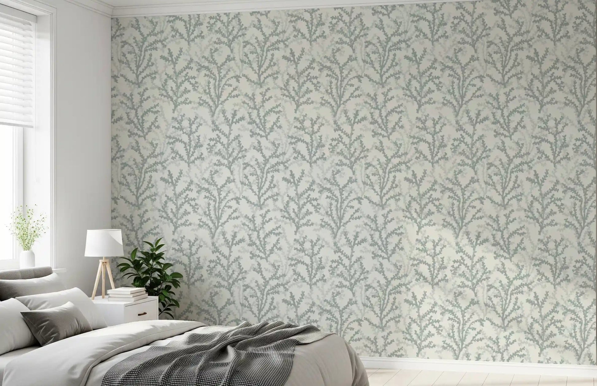 Coral sprigs scatter calm above the bedroom in this Painted Coraline wallpaper piece.