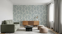 Painted Coraline Slate Gray wallpaper makes the living room feel aquatic.