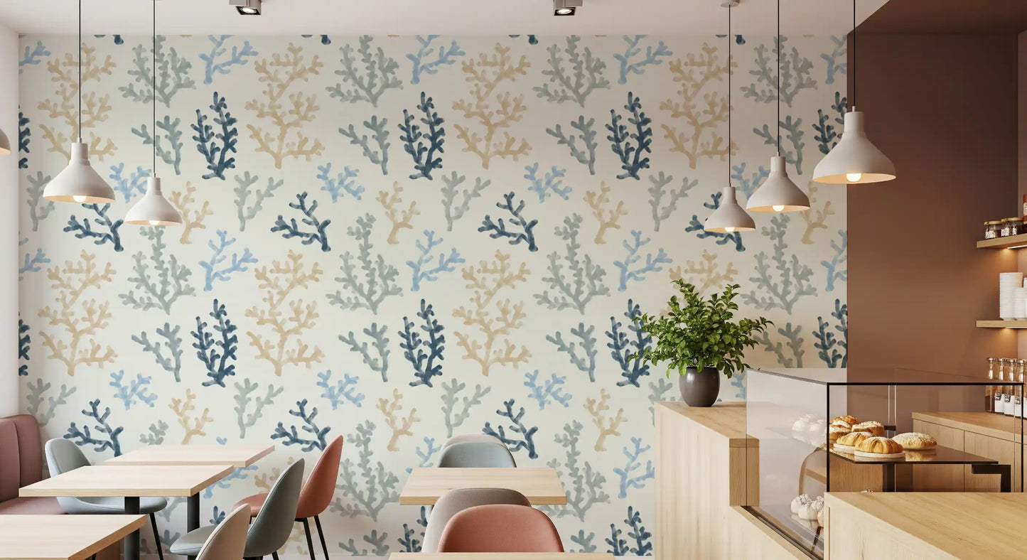 Patrons enjoy coffee near the Painted Corals Wallpaper installed in a modern cafe space.