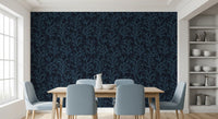 A Dining space balances white cribs with dark oceanic wallpaper backdrops.