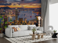 A vibrant sunset cityscape forms the Skyline wall mural behind a Living room