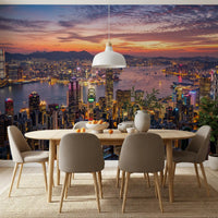 A spacious dining room features an illuminated Twilight wall mural cityscape.