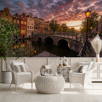 Vibrant sunset clouds float over houses in the Golden Hour Amsterdam Canal wall mural.
