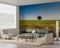 Lush green stalks sway beneath a single tree within the cheerful Meadow wall mural.