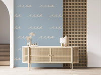 Home wallpaper showing pale surf motifs on a muted blue background