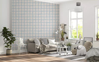Living room wall featuring Boho Coastal Wallpaper and simple olive checks