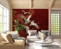 Living room wall mural with Crimson Sky Crane birds on a rich red backdrop