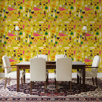 Dining nook styled in mustard produce wallpaper with fruit slice motifs