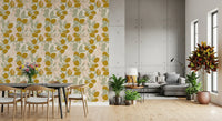 Golden citrus forms sit across Lemon Wallpaper with muted green leaves