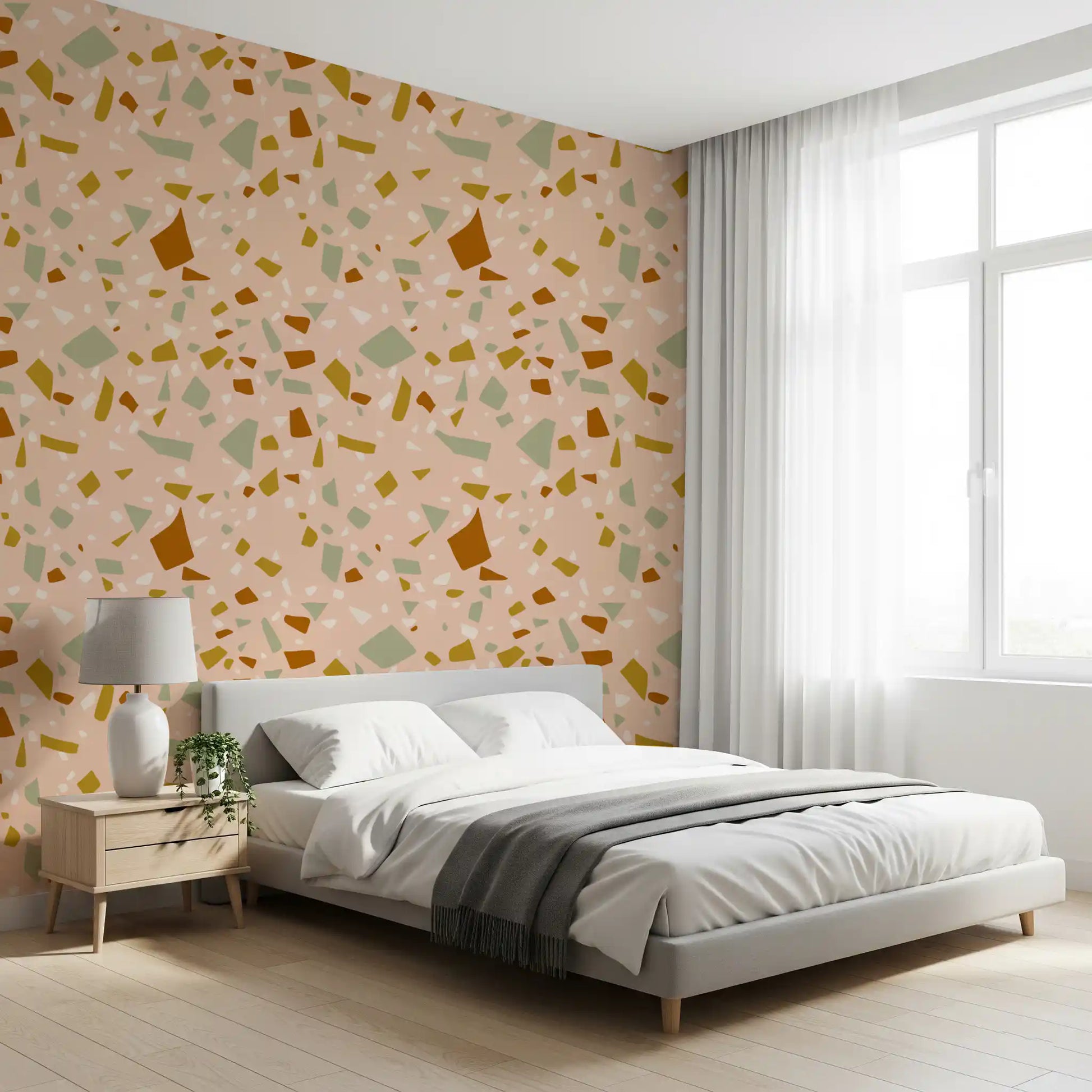 Bedroom wall carries Peach Sage Wallpaper and stone-style artwork