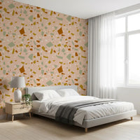 Bedroom wall carries Peach Sage Wallpaper and stone-style artwork
