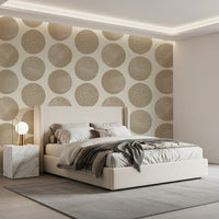 Bedroom wall with warm beige circle wallpaper and stippled cream pattern