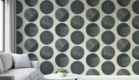 Office wall with cream dot wallpaper and dark blue textured motifs