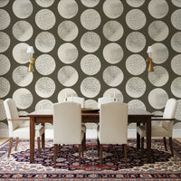 Dining room wall with brown polka dot wallpaper and textured cream circles