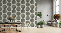 Dining room wall with grey dot wallpaper and textured circular pattern detail
