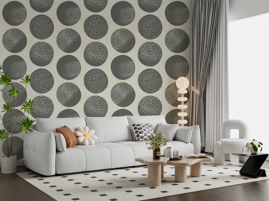 Living room with slate grey polka dot wallpaper on a soft cream background