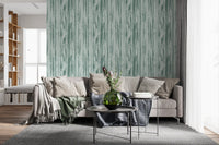 Hallway featuring muted blue wallpaper and uneven organic line marks