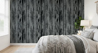 Bedroom featuring charcoal grey wallpaper with modern woodgrain surface detail