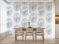 Small white five-petal blooms inside pale blue scalloped ovals on the wallpaper