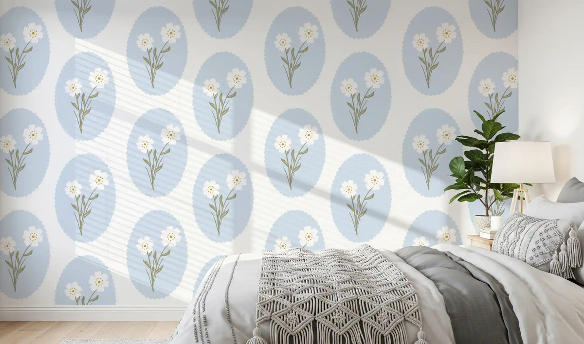 Pale blue ovals and tiny white blooms behind a bedroom headboard wallpaper