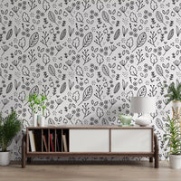 Inked florals on the white ground of Monochrome Leaves wallpaper