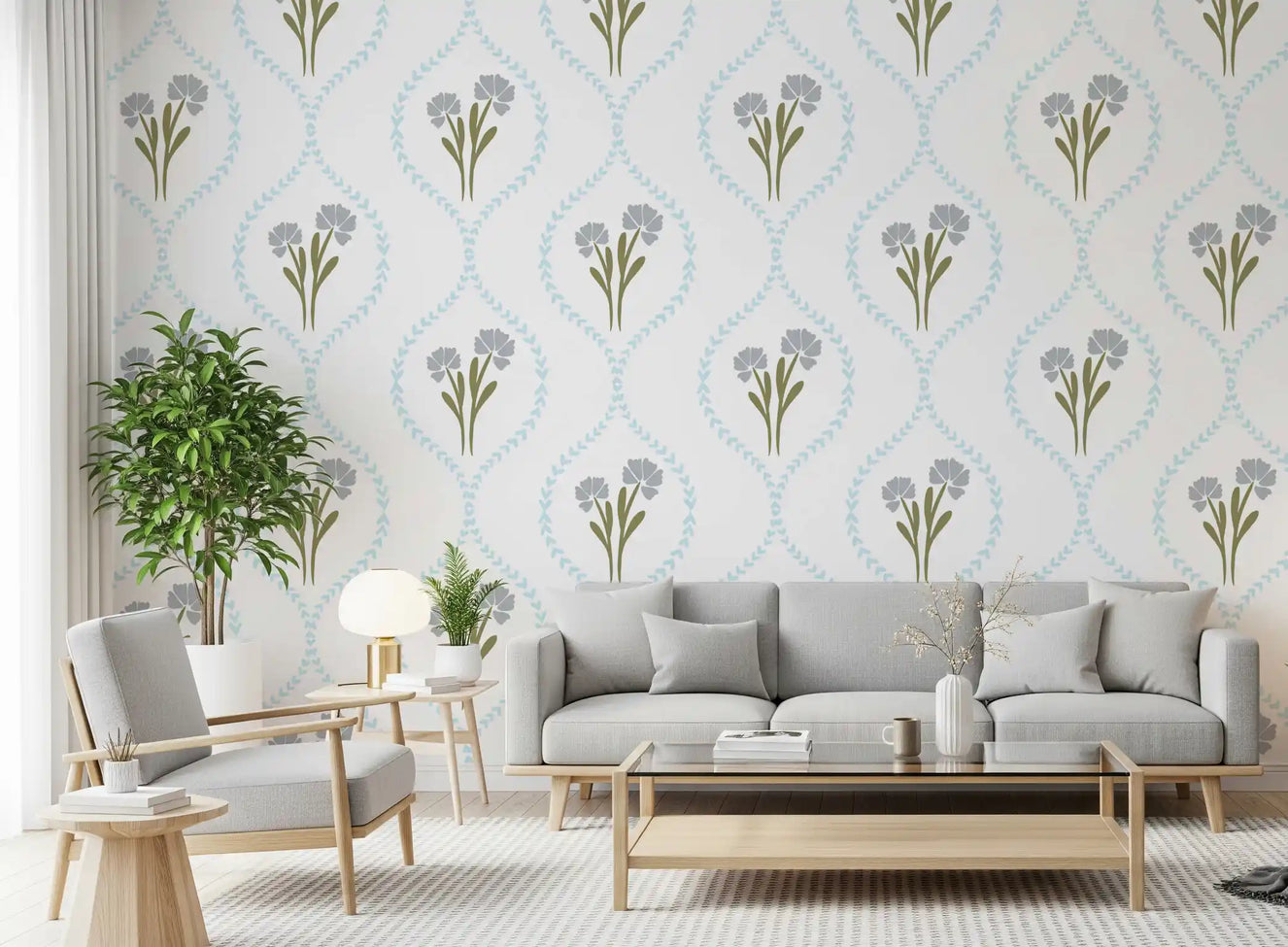 Cornflower trellis wallpaper behind a low sofa in a soft-toned living room