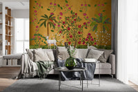 Living room backed by Regal Wildlife Paradise wall mural in gold, pink and green tones