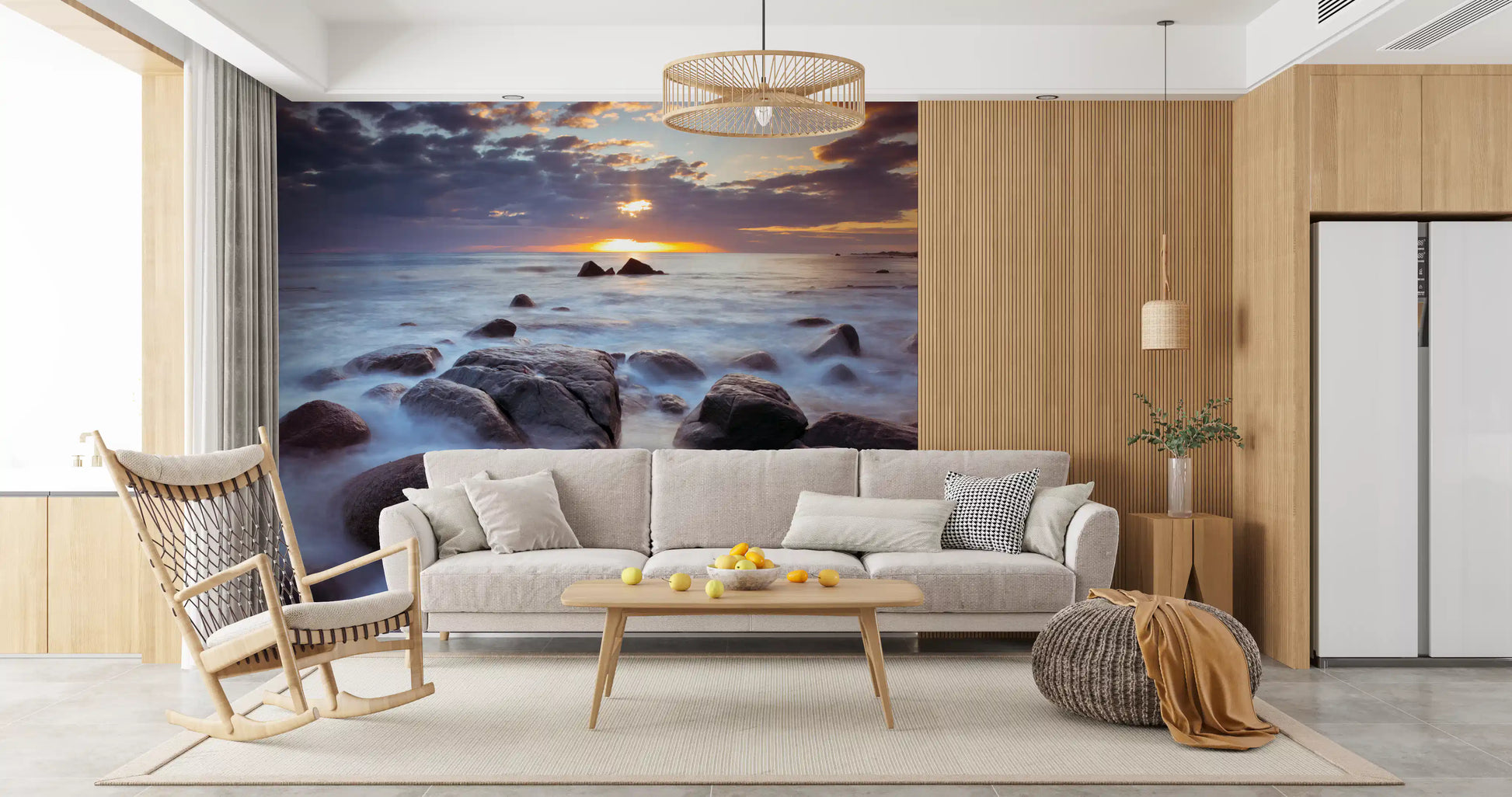 Living room paired with a misty rock and sea wall mural at sunset