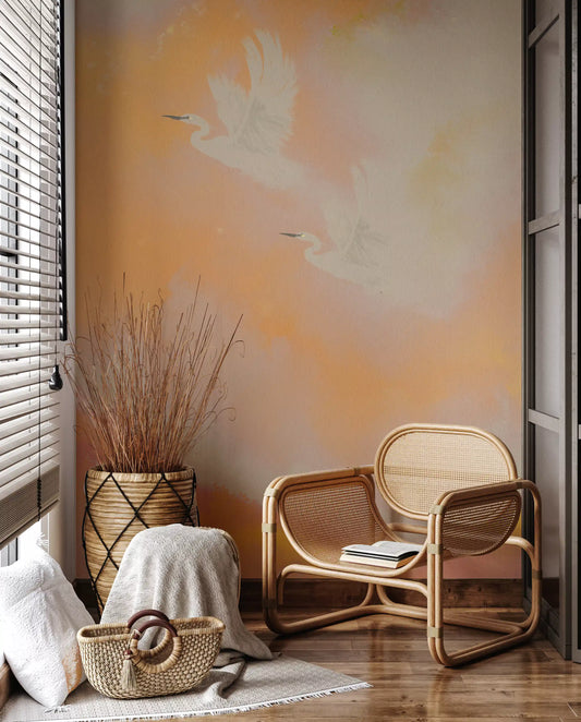 Living room styled around a warm coral heron wall mural