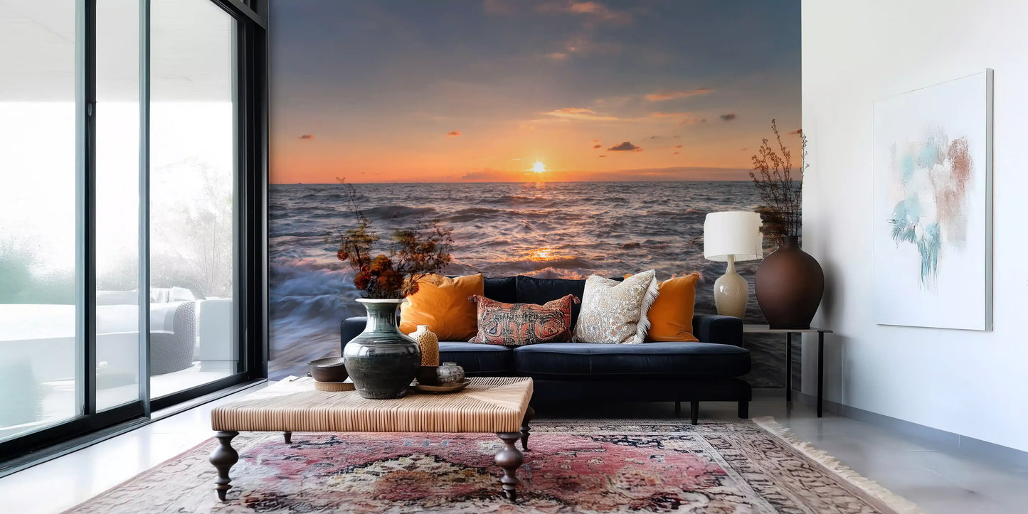 Calm living room filled with a fiery ocean sunset wall mural view