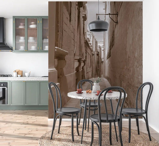Sepia stone passage wall mural runs along a bright Kitchen and dining room