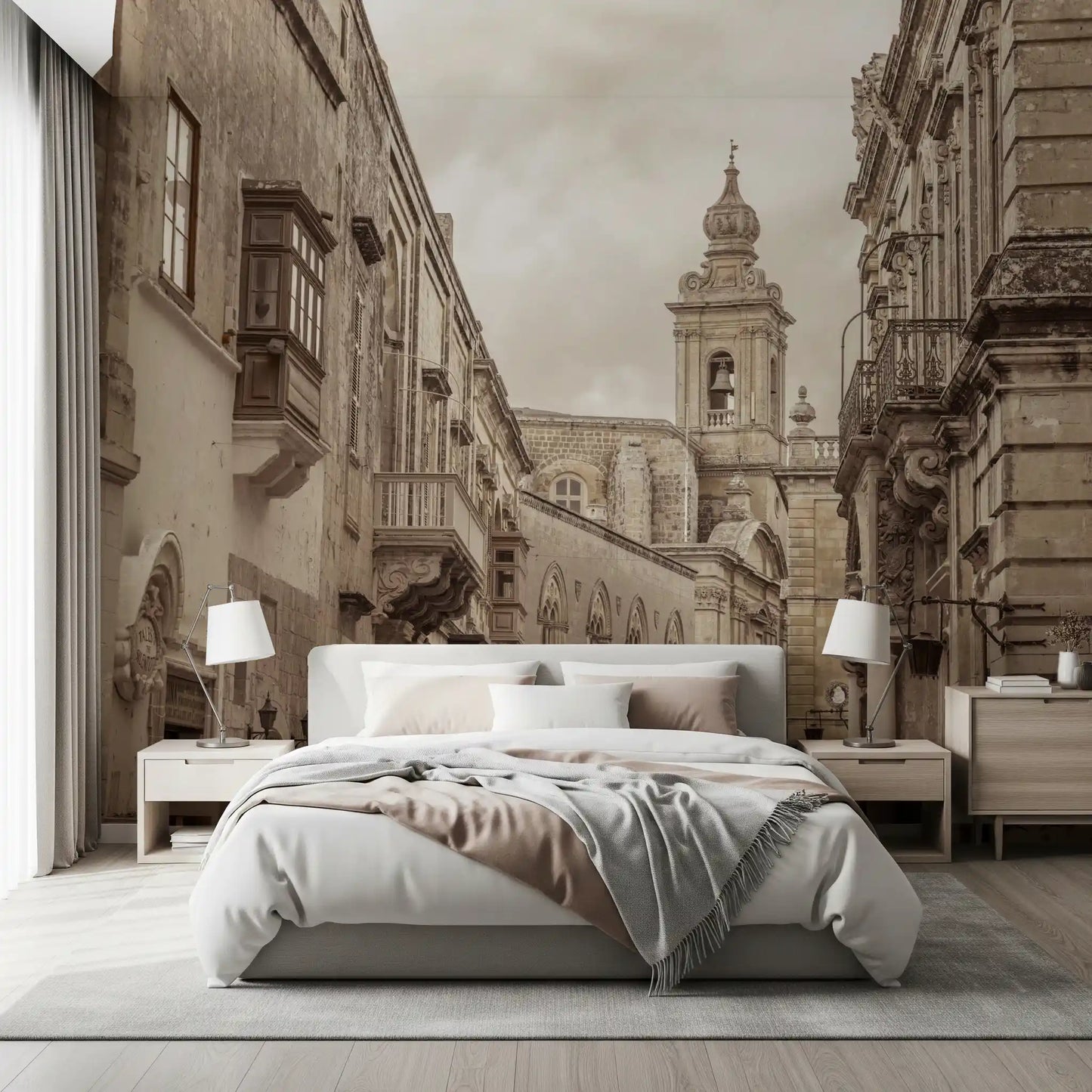 Bedroom scene led by the Mdina wall mural and its baroque spire