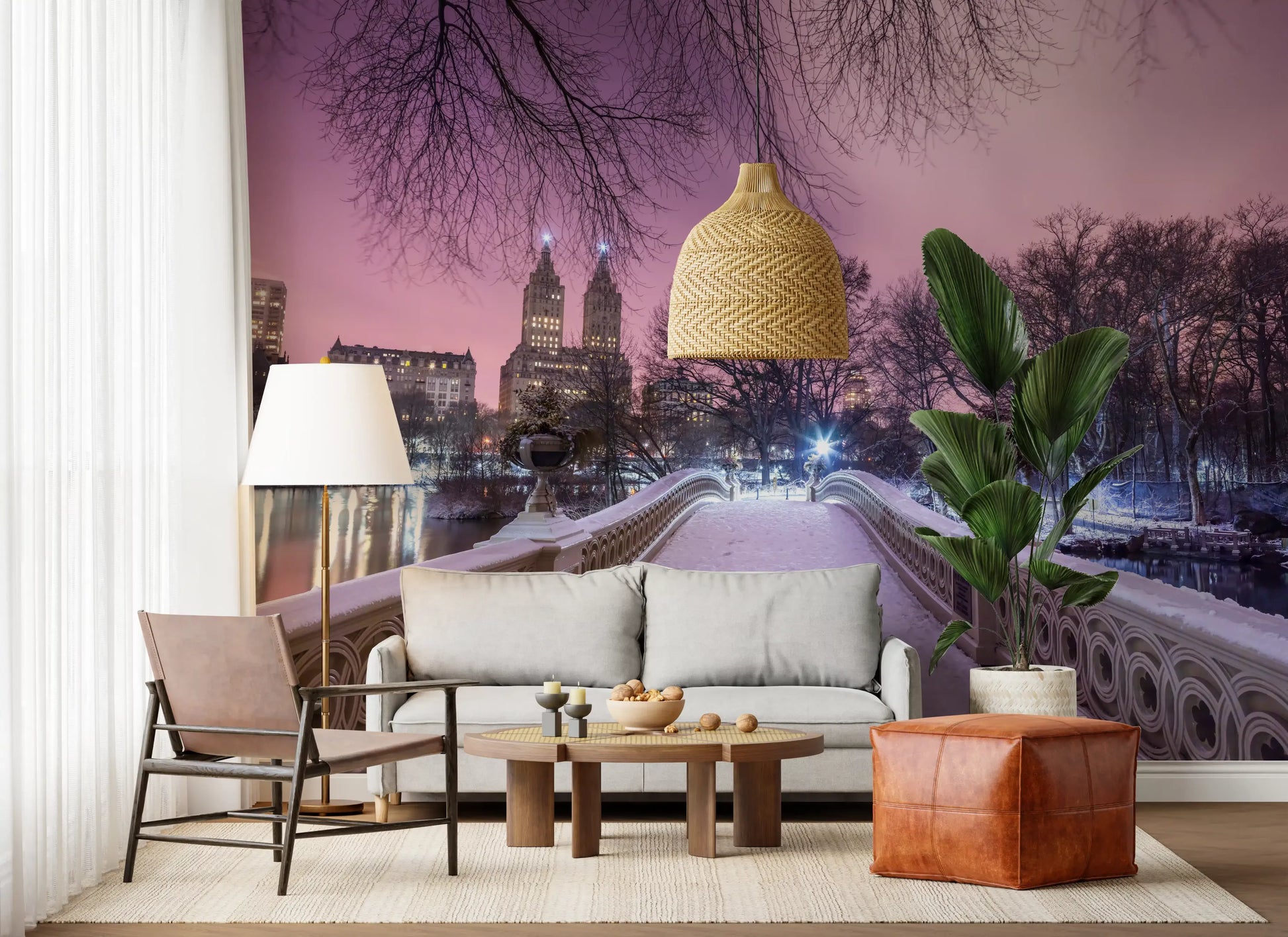 Living room backdrop glowing with the pink Central Park Bow Bridge Winter scene
