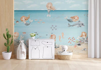 Four mermaids and a dolphin fill the Mermaid Lagoon wall mural