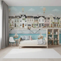 Hot air balloons float above rooftops in this Quaint Canal Town wall mural
