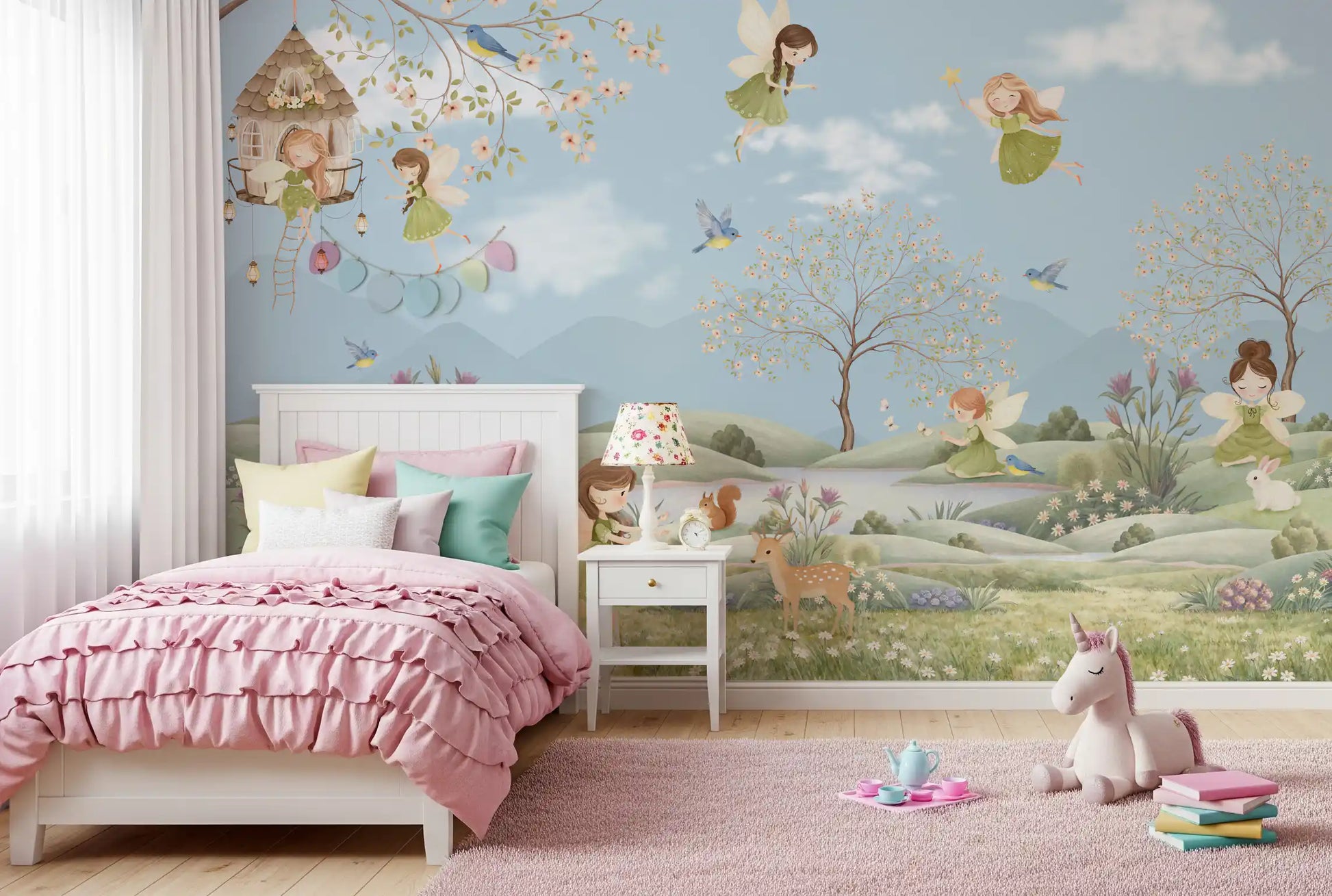 Toddler room glows beside the green meadow of the Fairy Dreams wall mural