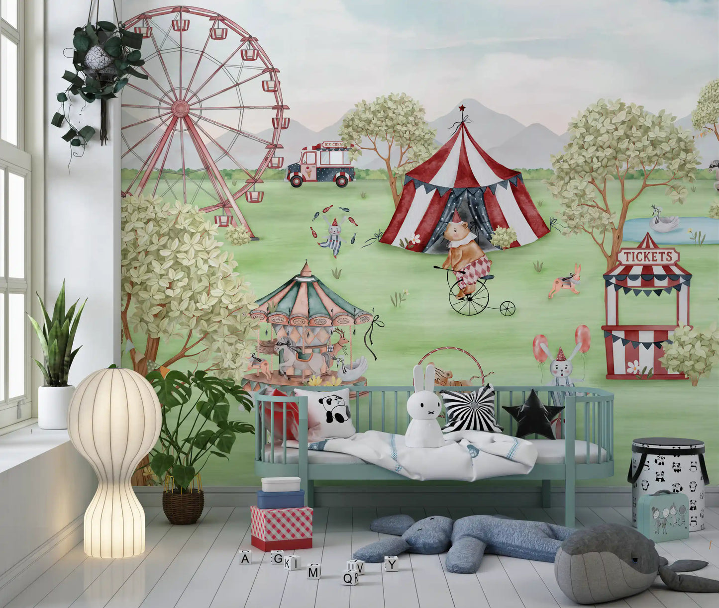 Nursery area nook set against the meadow carnival wall mural