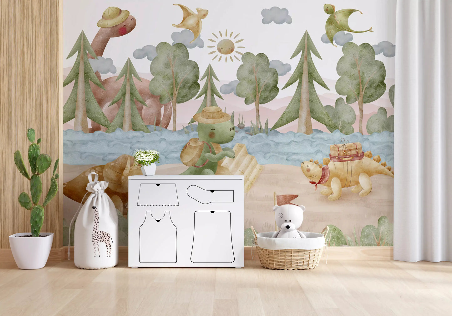 Play area dressed around the Little Dino Explorer's wall mural in sage and blush