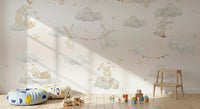 A sleeping rests on a cloud pillow within the Bunny Cloud Adventures wall mural