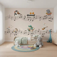Bright nursery backed by playful musical animals on the wall mural in cream and sage