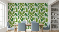 Dining area sits before the fern wallpaper with greens on a white ground.