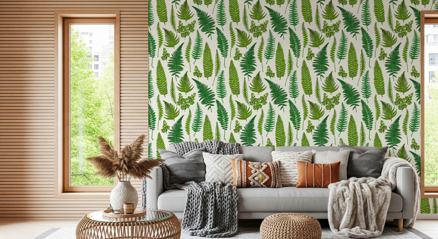 green ferns sit in loose order on the natural white wallpaper.