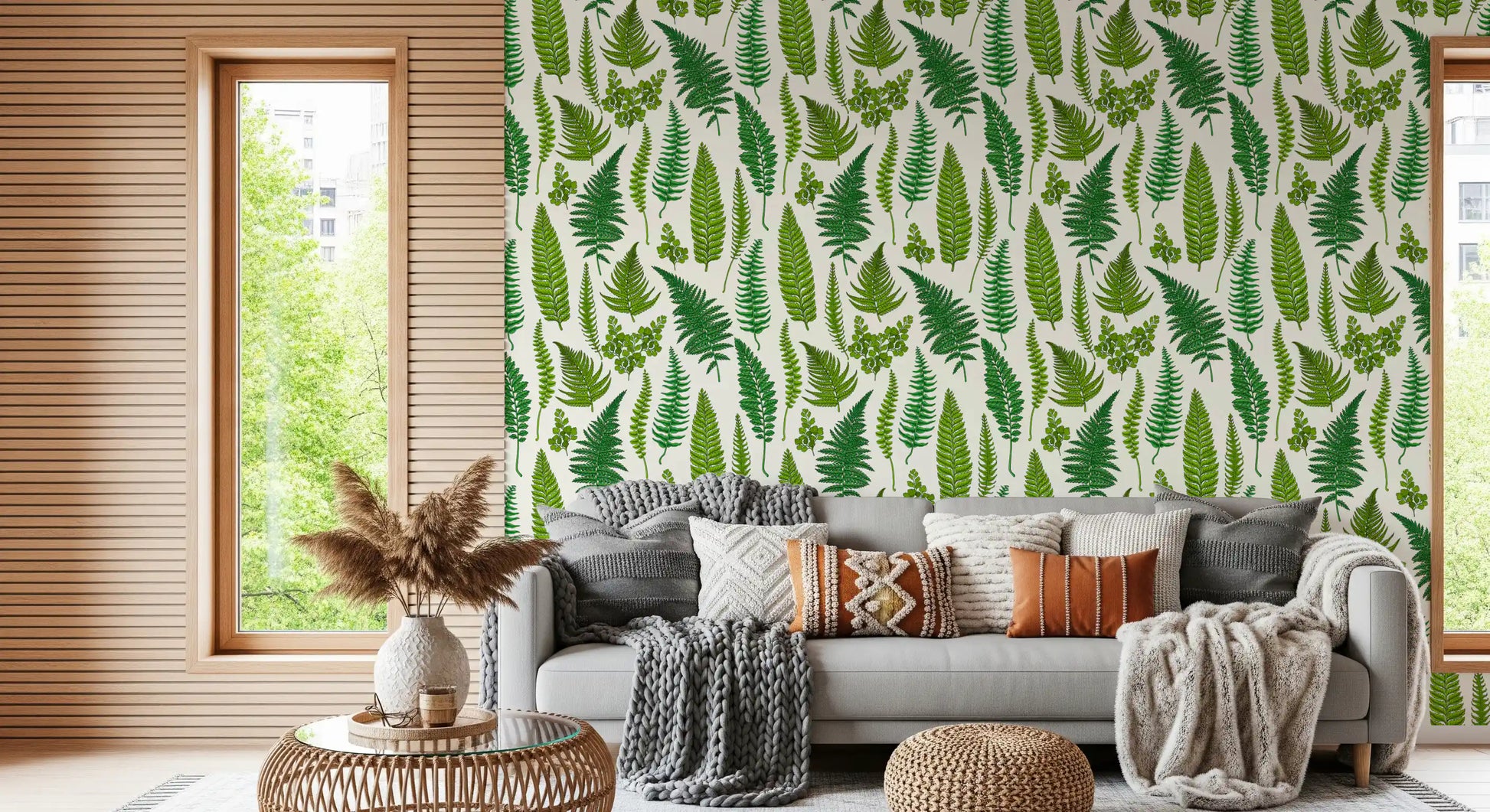 green ferns sit in loose order on the natural white wallpaper.