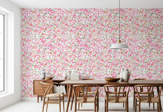 Pink, coral and peach florals cover the dining room in Daisy Dance wallpaper