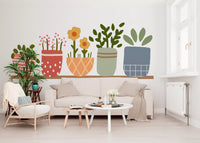Daisy heads, polka dot pots and grid checks this wall mural with playful charm.